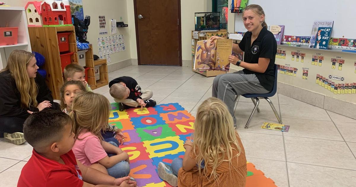 High School Students Read To Preschoolers At Dayspring Academy