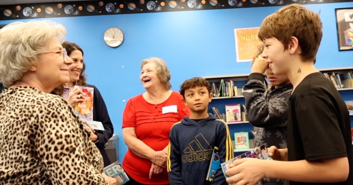 Volunteers Deliver Hundreds Of Books To Elementary School On Giving Tuesday